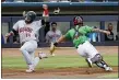  ?? JOE BOJC — FOR THE NEWS-HERALD ?? Captains catcher Bryan Lavastida tries to hang on to the ball during a play at the plate July 22.