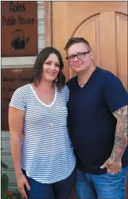  ?? JORDANA JOY — THE MORNING JOURNAL ?? Cole’s Public House marketing director Nicole Lucas, left, and executive chef and co-owner Robby Lucas, pose outside the original entrance to their restaurant. Now, the restaurant will be taking over Cork Tree Restaurant, 209 S. Main St. in Amherst, in an expansion.