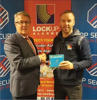  ??  ?? Niall Walsh, Sligo Branch Manager, receiving award from Top Security.
