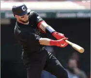  ?? TONY DEJAK — THE ASSOCIATED PRESS ?? The Indians’ Kevin Plawecki hits an RBI single in the seventh inning against the Royals on Aug. 25 at Progressiv­e Field.