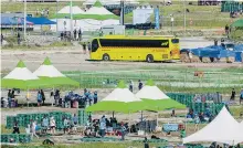  ?? AFP-Yonhap ?? Scouts prepare to leave the World Scout Jamboree in Saemangeum, North Jeolla Province, Aug. 8, 2023. Tens of thousands of Scouts were evacuated from their problem-plagued Korean campsite ahead of a typhoon.