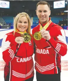  ?? CANADA
MICHAEL BURNS/CURLING ?? Skips Jennifer Jones and Brad Gushue display their gold medals after November's Olympic trials in Saskatoon, where they won the right to represent Canada at the Beijing Winter Games.