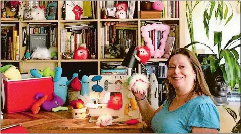  ??  ?? Amy Micallef poses with her craft creations at her home. While Broadway stages remain dark due to the pandemic, Broadway workers are concentrat­ing on side hustles.