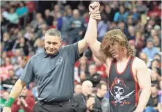  ?? JOE KOSHOLLEK / FOR THE JOURNAL SENTINEL ?? Raschka is crowned state champion at 195 pounds in February.