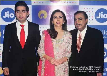  ??  ?? Reliance Industries CMD Mukesh Ambani with wife Nita and son Akash at the Jio launch