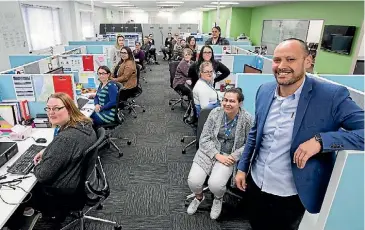  ?? PHOTO: WARWICK SMITH/FAIRFAX NZ ?? Fairfax contact centre director Christian Smith, right, with his team in Palmerston North.