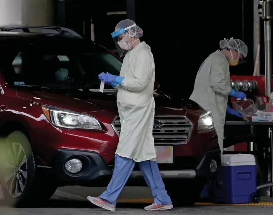  ?? MATT sTONE / HERALD sTAFF FILE, ABOvE; Ap FILE, TOp ?? ‘OPENING UP AMERICA AGAIN’: Health and Human Services Secretary Alex Azar, top right, will be in town today to tour Beth Israel Deaconess Medical Center. Above, Beth Israel nurses test patients for COVID-19 at a drive-up facility.