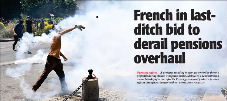  ?? Photo: Nampa/AFP ?? Opposing reform… A protester standing in tear gas yesterday threw a projectile during clashes with police on the sidelines of a demonstrat­ion on the 14th day of action after the French government pushed a pension reform through parliament without a vote.