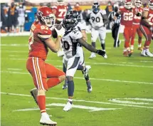  ?? Andy Cross, The Denver Post ?? Chiefs tight end Travis Kelce ( 87) catches a touchdown pass against Broncos cornerback Duke Dawson ( 20) during Sunday night’s game in Kansas City, Mo.