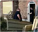  ??  ?? DEFENCES: Workmen fit security grilles to the Osborn-Brookses’ home. A surveillan­ce camera has also been set up nearby