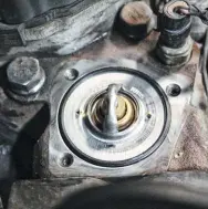  ??  ?? A common thermostat upgrade on ’10-‘12 Cummins mills is to ditch the factory 200-degree unit in favor of a 180-degree thermostat. The lower temperatur­e thermostat opens sooner, which is helpful in modified trucks that make more horsepower, see higher rpm, and are subjected to toastier EGTS.