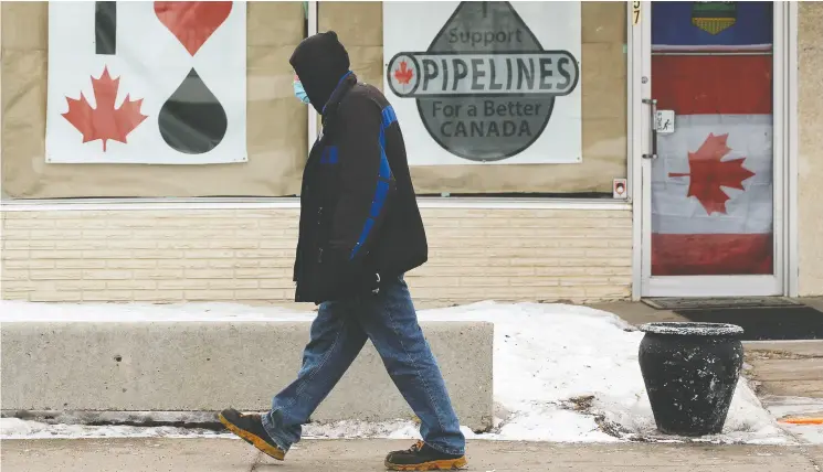  ?? DAVID BLOOM / POSTMEDIA NEWS ?? Posters in support of Canadian oil are displayed in Edmonton as Alberta reels after U.S. President Joe Biden killed the Keystone XL project on his first day in office.