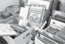  ?? AMY BETH BENNETT/SOUTH FLORIDA SUN SENTINEL PHOTOS ?? Two decades worth of mayoral souvenirs await boxing in Mayor Richard Kaplan’s office.