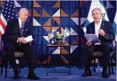  ?? BRENDAN SMIALOWSKI / TNS ?? President Joe Biden listens to Israel’s Prime Minister Benjamin Netanyahu as he reads a statement in Tel Aviv last October.