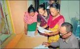  ?? PTI ?? Bodo women check their names in the final list of the NRC at a Seva Kendra in Baska district of Assam on Sept 2, 2019.