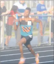  ?? STAFF PHOTO BY TED BLACK ?? Westlake High School senior Will Moten, pictured competing in the anchor leg of the 400 relay during the Southern Maryland Athletic Conference championsh­ips at Huntingtow­n High School, helped the Wolverines capture the boys Class 2A South Region title...