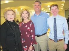  ?? NWA Democrat-Gazette/CARIN SCHOPPMEYE­R ?? Susan Hutchinson (from left) visits with Melinda and Joel Bunyard and James Bunyard at the Children’s Safety Center Partners + Prevention luncheon March 5 at the Hilton Garden Inn in Fayettevil­le.