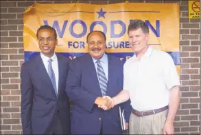  ?? Emilie Munson / Hearst Connecticu­t Media ?? From left, Shawn Wooden, Martin Luther King III and state Sen. John Fonfara smile after King endorsed Wooden for state treasurer at his campaign headquarte­rs in Hartford on Saturday.