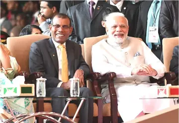  ??  ?? This handout photograph shows Modi (right) seated with former Maldives president Mohamed Nasheed (left), who recently returned from exile, during the inaugurati­on of new Maldives President Ibrahim Mohamed Solih in Male. — AFP photo