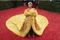  ??  ?? RIHANNA IN GUO PEI’S FURTRIMMED CAPE AT THE 2015 MET GALA; LIBERACE WAS AS FAMOUS FOR HIS CAPES AS FOR HIS PIANO PLAYING.