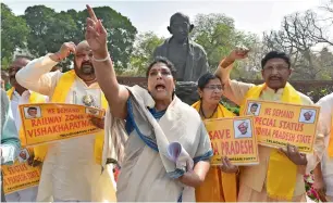  ?? PTI ?? TDP leaders and Congress MP Renuka Chowdhury raise slogans demanding special status for Andhra Pradesh during the budget session at Parliament House in New Delhi on Monday. —
