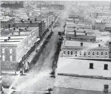  ?? SPECIAL TO THE EXAMINER ?? This view of George Street looking north from Simcoe seems to date from around 1880. The large building on the left in the distance was the Militia Hall, which was built on what is now Confederat­ion Square in 1866. This photo came to my attention only...