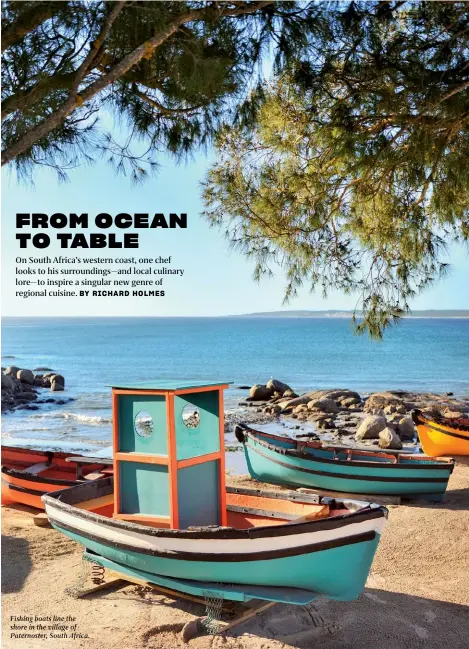  ??  ?? Fishing boats line the shore in the village of Paternoste­r, South Africa.