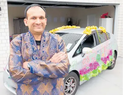  ?? Photo / Leon Menzies ?? Ola driver Bankim Patel has decorated his car to spread the joys of Diwali in Auckland.