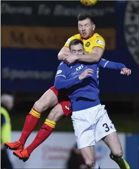  ??  ?? Partick Thistle’s Darren Brownlie tussles with Kevin Holt