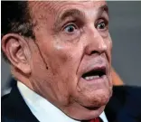  ??  ?? Sweat: Rudy Giuliani’s hair dye runs during a media briefing last year