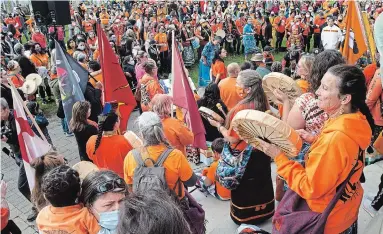  ?? MATHEW MCCARTHY WATERLOO REGION RECORD FILE PHOTO ?? Hundreds of people walked through downtown Kitchener to Victoria Park on Sept. 30, the inaugural National Day for Truth and Reconcilia­tion, where some sang and drummed, during an event hosted by the Healing of the Seven Generation­s.