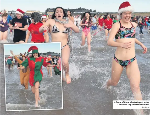  ?? Ben Birchall ?? > Some of those who took part in the Christmas Day swim in Porthcawl