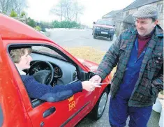  ??  ?? Below, rural postwoman Linda Malyon hands over the post to Ipstones farmer Mick Reeves.