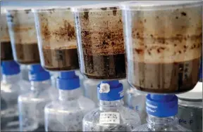  ?? The Canadian Press ?? Tailings samples are being tested during a tour of Imperial’s oil sands research centre in Calgary, Aug. 28, 2018. Recent leaks of toxic tailings from northern Alberta oilsands mines have revealed serious flaws in how Canada and Alberta look after the environmen­t, observers say.