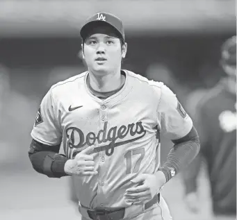  ?? KIM HONG-JI/REUTERS VIA USA TODAY SPORTS ?? Dodgers superstar Shohei Ohtani signed a 10-year, $700 million deal with the organizati­on this offseason.