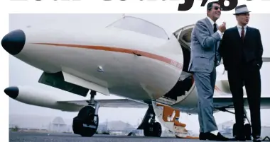  ??  ?? High society: Singers Dean Martin and Frank Sinatra pose with the latter’s Learjet in 1965