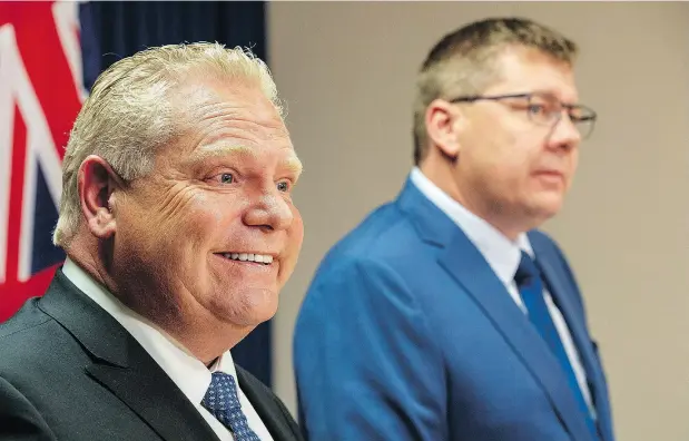  ?? LIAM RICHARDS / THE CANADIAN PRESS ?? Ontario Premier Doug Ford, left, and Saskatchew­an Premier Scott Moe levelled criticism at the federal carbon tax Thursday in Saskatoon.