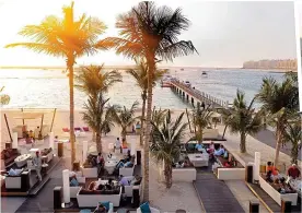  ??  ?? THE HIGH LIFE: The Jetty Lounge at One&Only Royal Mirage. Above right: Children love the Middle East’s fabulous sandy beaches