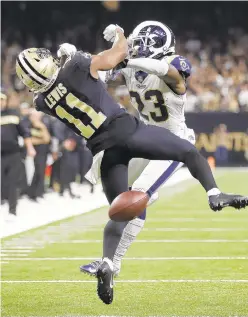  ?? AP ?? The Saints’ Tommylee Lewis is interfered with by the Rams’ Nickell Robey-Coleman during the NFC championsh­ip game, but there was no call. A lawsuit over the play has been allowed to continue.