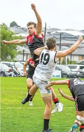  ?? ?? Crashing together during a marking contest are Warragul’s Thomas Crole and Warragul’s Jakeb Thomas.