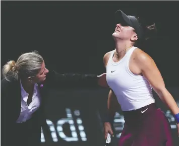  ?? LINTAO ZHANG/GETTY IMAGES ?? Canada’s Bianca Andreescu says she found herself in acute pain and her movement was very limited after she hurt her left knee during Wednesday’s action at the WTA Finals in Shenzhen.