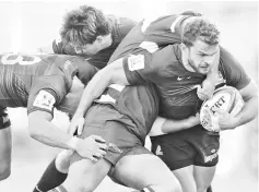  ??  ?? Argentina’s Jaguares wing Ramiro Moyano (R) vies for the ball with South Africa’s Stormers forward JC Janse van Rensberg (C) during their Super Rugby match at Jose Amalfitani stadium in Buenos Aires, on June 30, 2018.