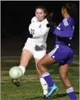  ??  ?? Monache High School’s Haylee Castaneda, left, clears the ball Tuesday during the first half against Lemoore High School.