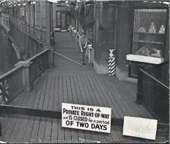  ?? MILWAUKEE JOURNAL ?? The riverwalk behind First Wisconsin National Bank was closed to pedestrian­s on Oct. 28-29, 1949. The reason: Leaving the walkway open to the public for too many consecutiv­e years would make the walk revert to public ownership.