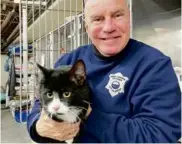  ?? MASSACHUSE­TTS ENVIRONMEN­TAL POLICE ?? Daniel Gillis, animal control officer supervisor for Boston, with Charles.