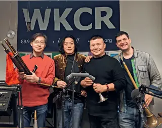  ?? Tanaka Mari ?? Mu Qian (first left) with the Zhou Family Band at the radio station WKCRFM.