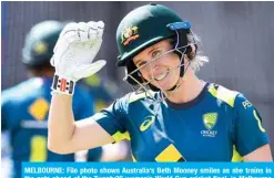  ??  ?? MELBOURNE: File photo shows Australia’s Beth Mooney smiles as she trains in the nets ahead of the Twenty20 women’s World Cup cricket final, in Melbourne on March 7, 2020. — AFP