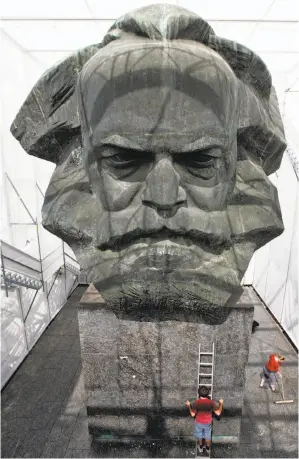  ?? Uwe Meinhold / AFP / Getty Images 2008 ?? Karl Marx was wrong about communism but his economic prediction­s were spot on.