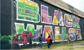  ?? Sue Ogrocki/AP ?? A mural in Tulsa, Oklahoma, home of the country’s best-known Black Wall Street. Photograph: