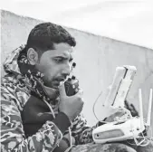  ?? ACHILLEAS ZAVALLIS, AFP/GETTY IMAGES ?? A soldier from Iraqi Special Operations Force 2 operates a drone during a mission to retake Mosul from the Islamic State.